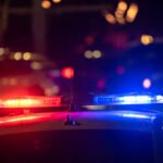 Police car with flashing lights on at night